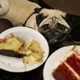 A pug staring up at visitors eating cake at a pop-up Pug Cafe in Brick Lane, east London on October 27, 2017